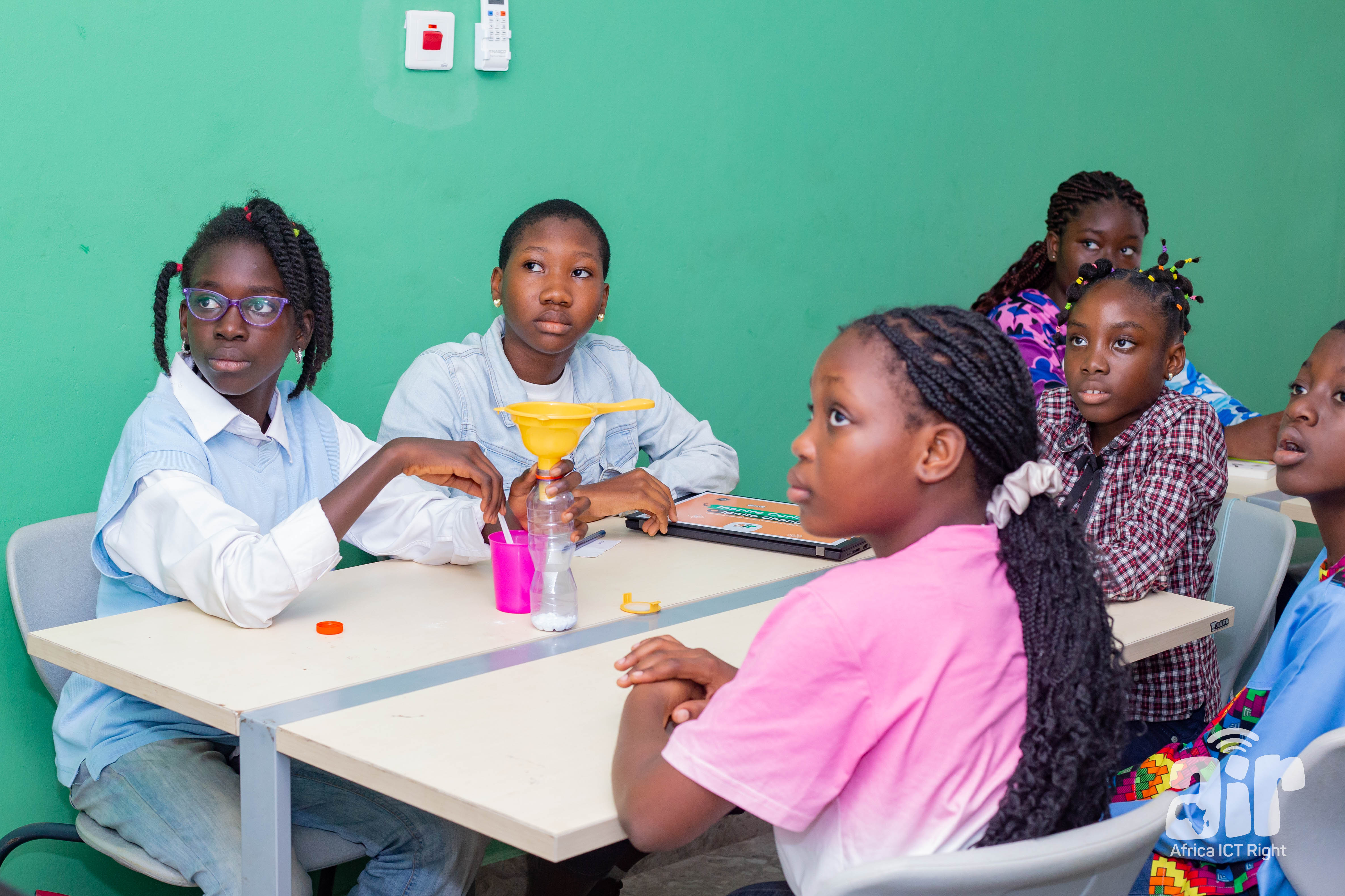 Students in a classroom with science equipment during a STEM lesson