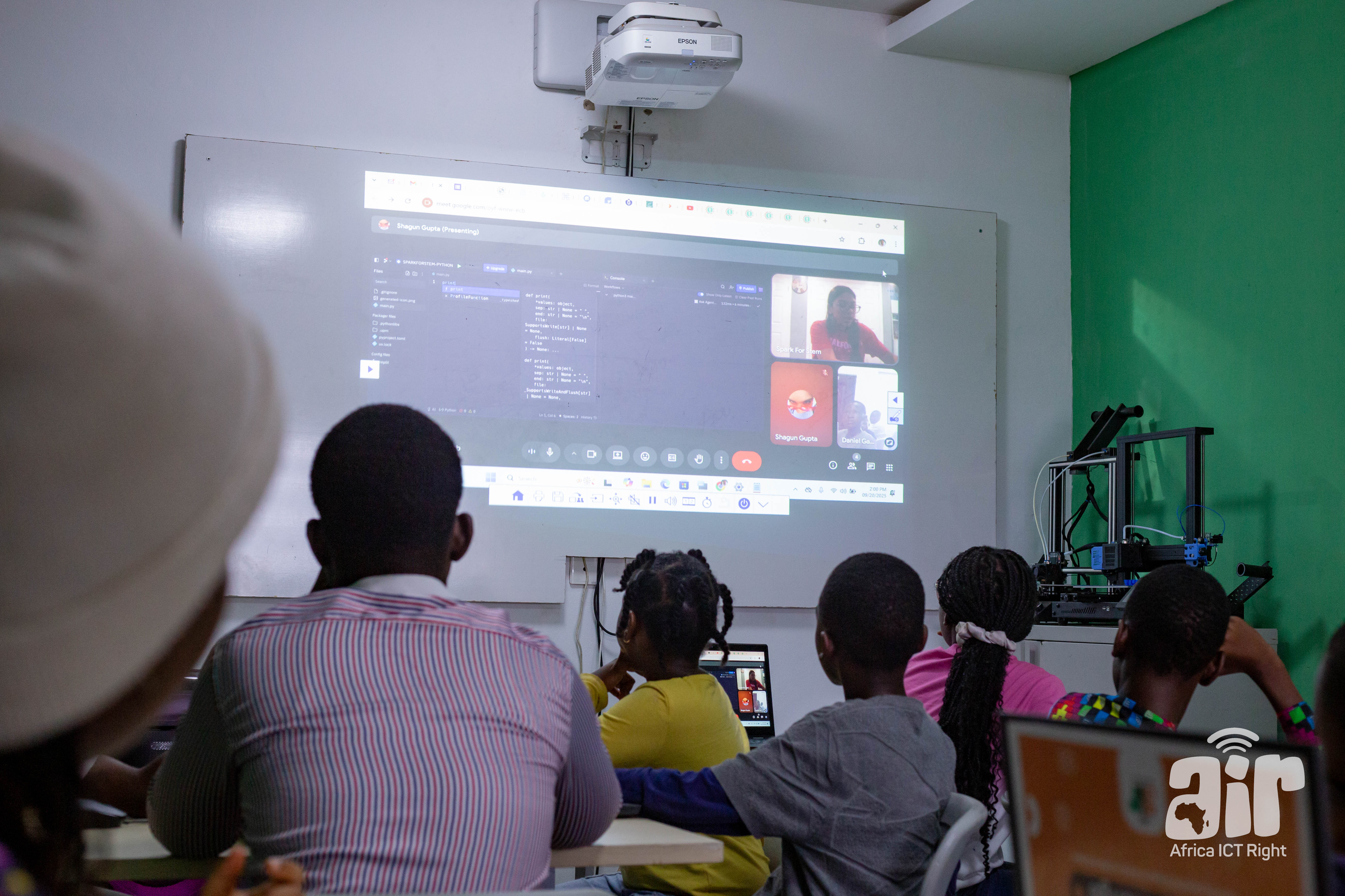 Students learning Python coding through a virtual session