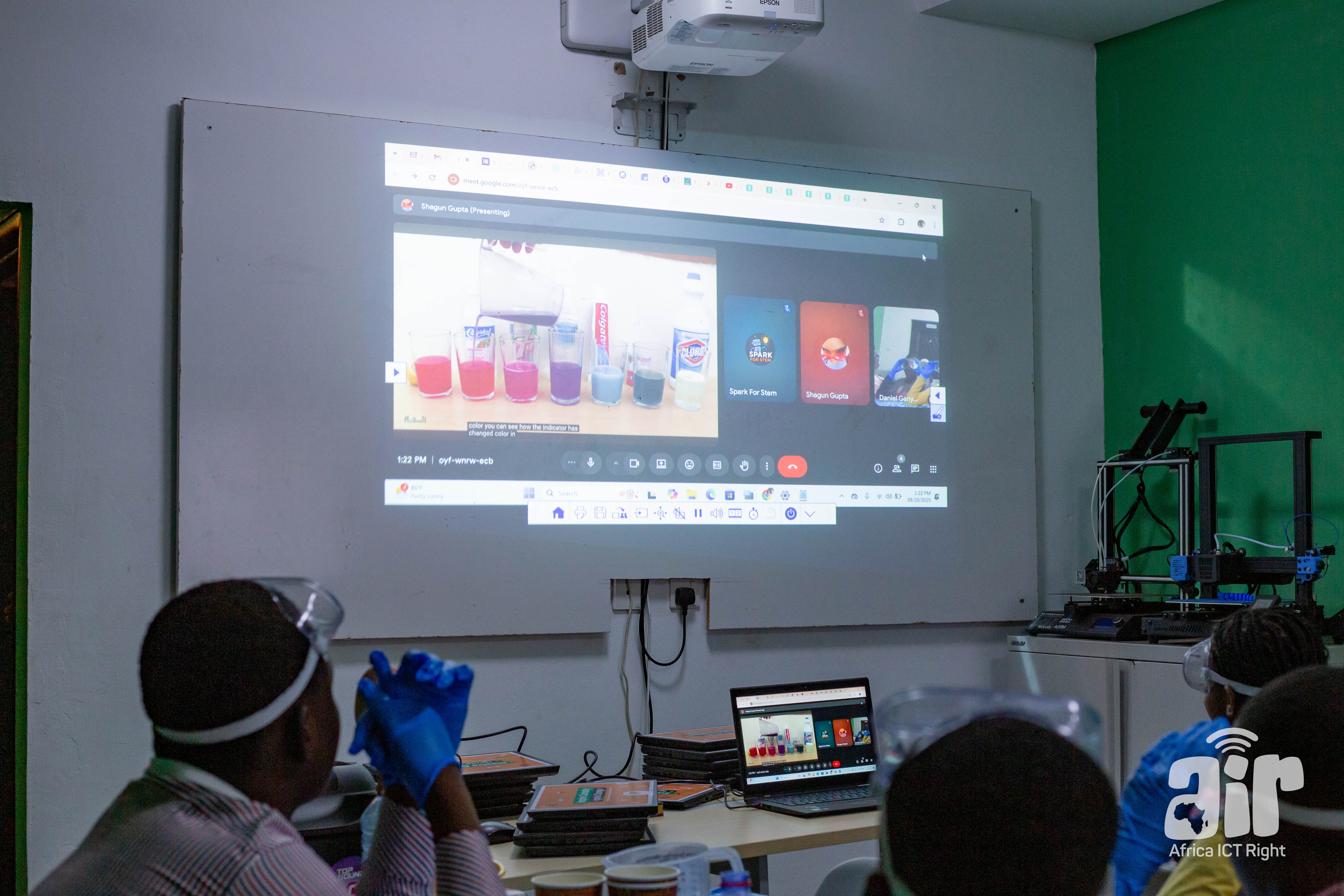 Students watching a chemistry demonstration via video call
