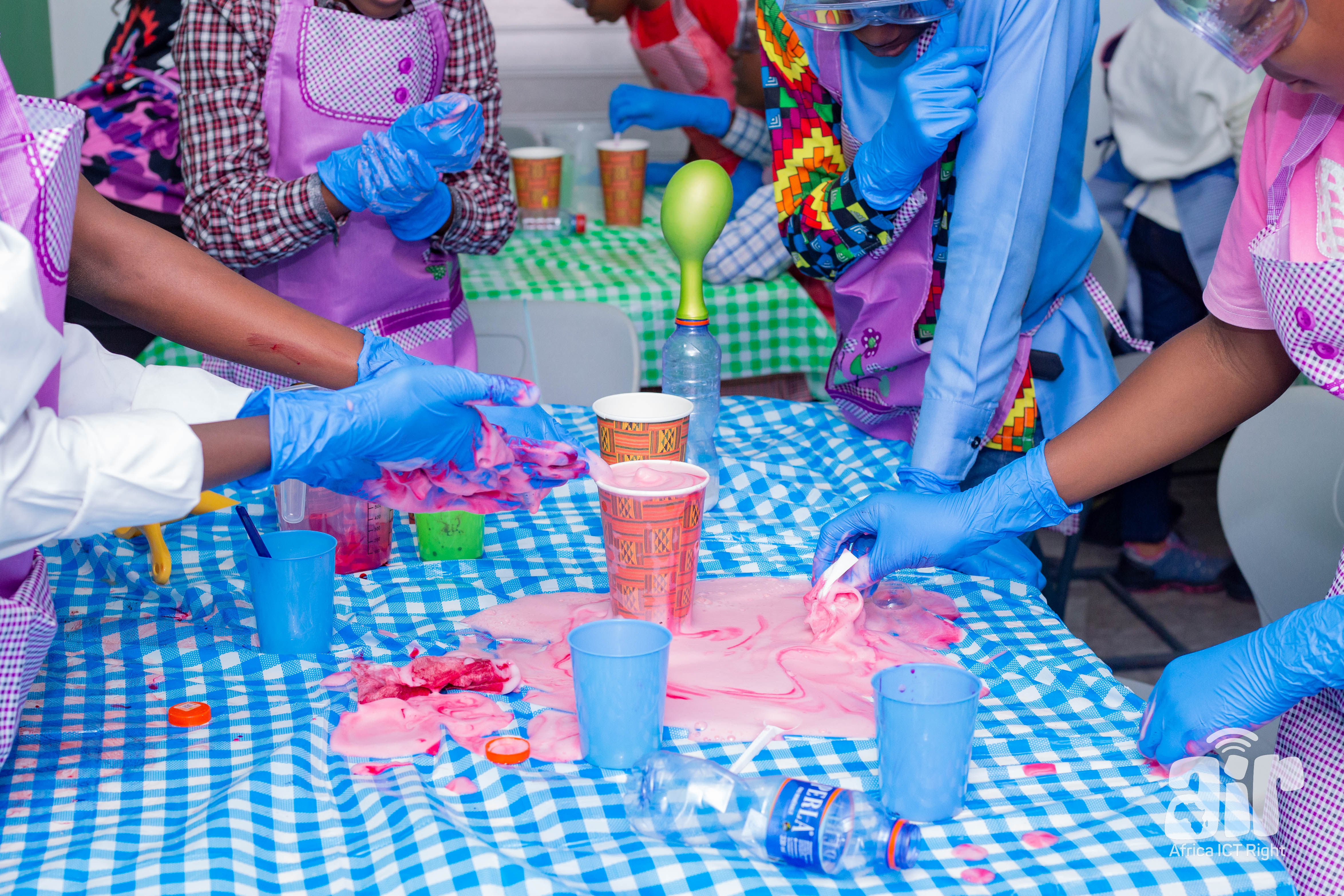 Students doing hands-on chemistry experiments with safety gear