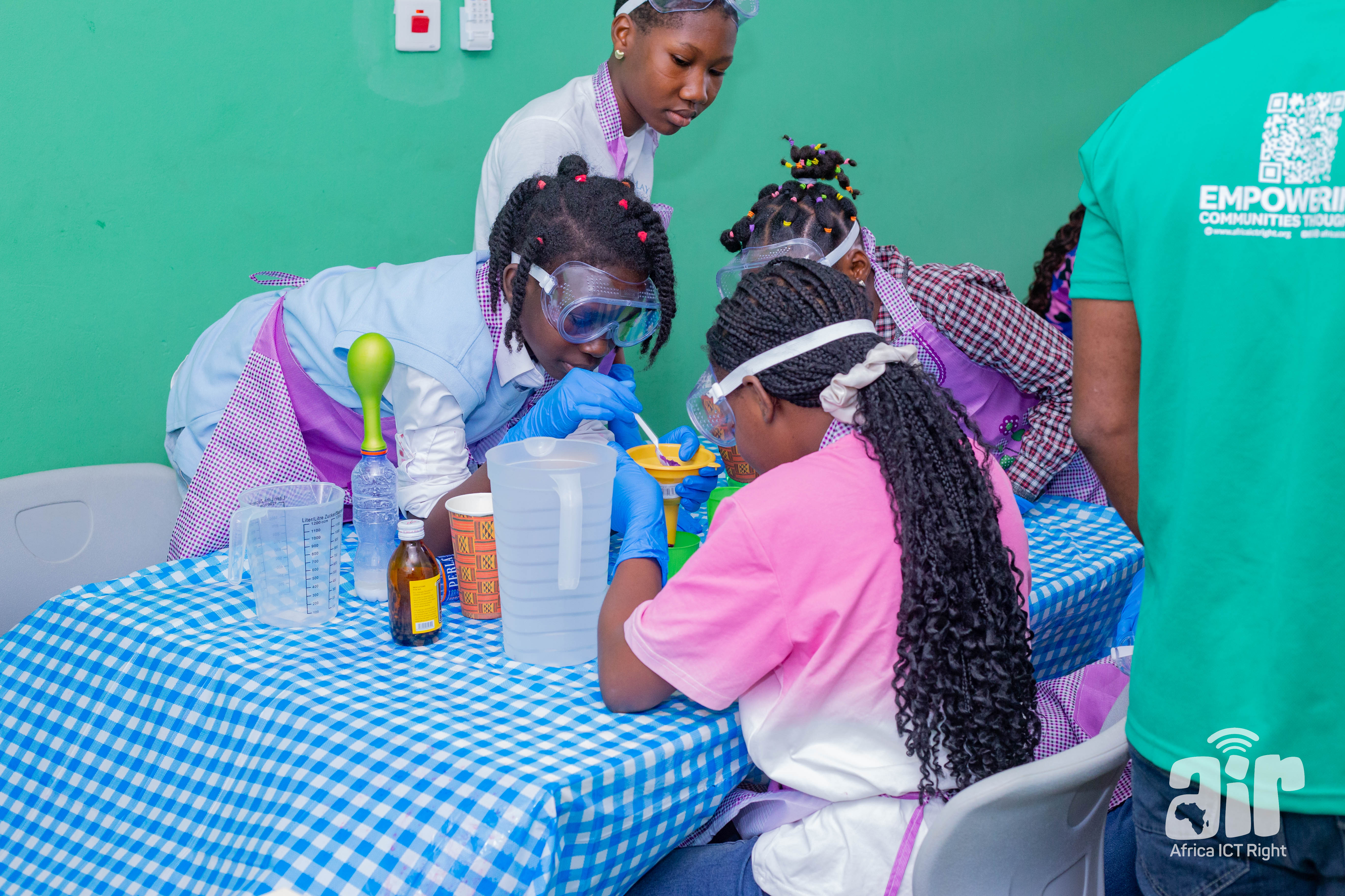 Students conducting science experiments with safety goggles and gloves